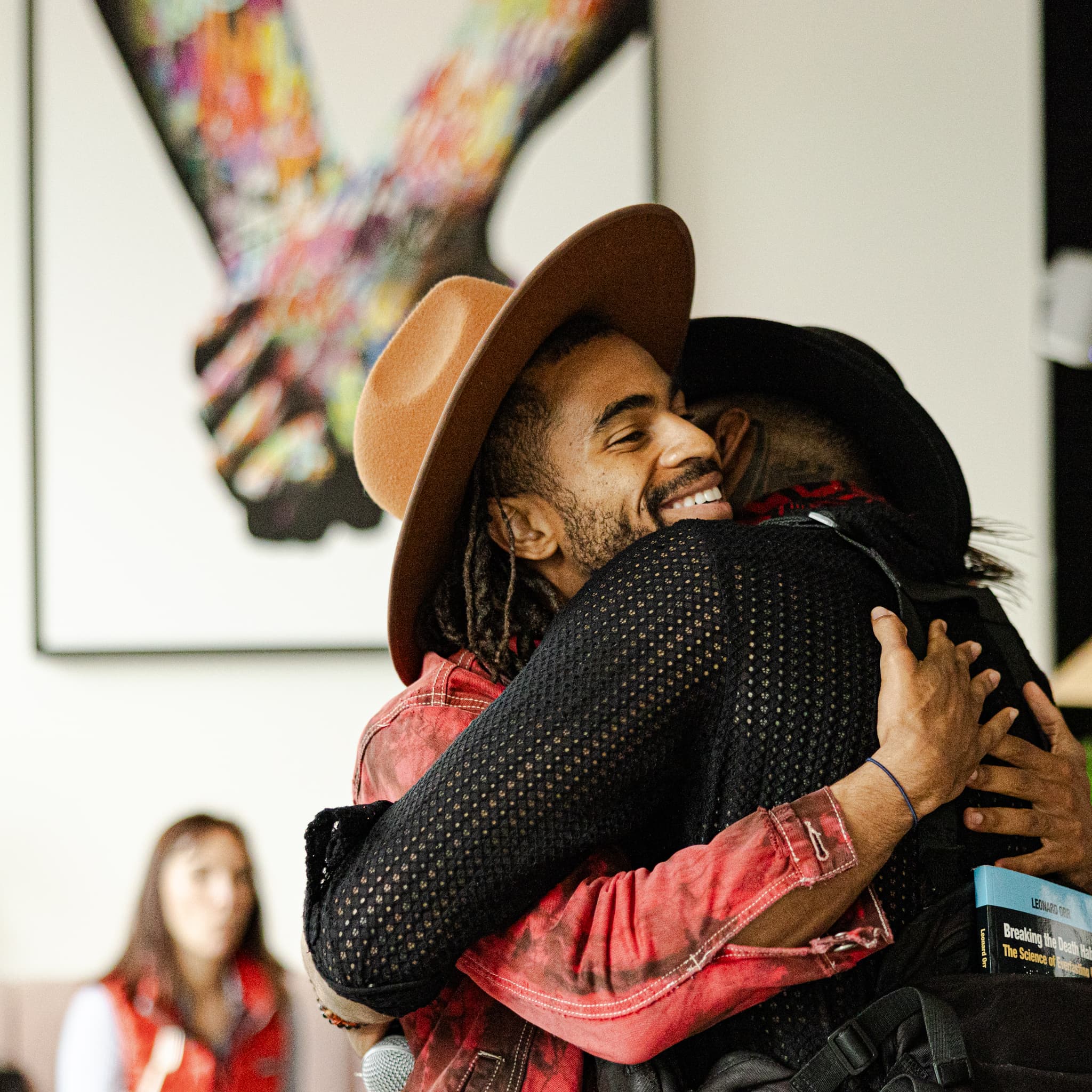 Imari Tuakli with a participant after a coaching event
