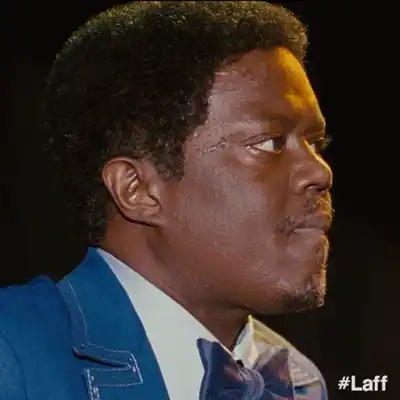 Imari preparing to perform at an open mic comedy night